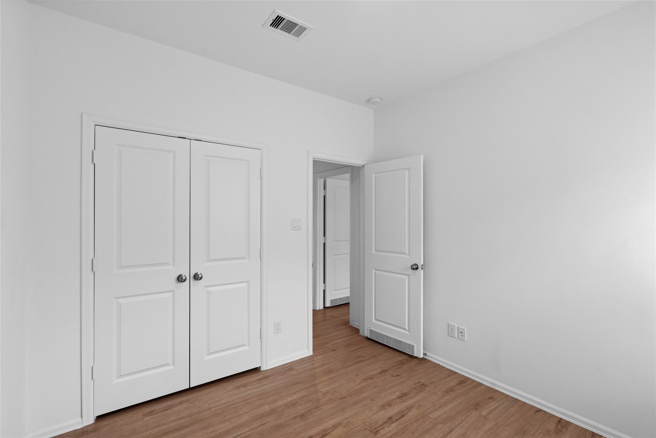 3705 Paloma Fls Lane Rosenberg, TX 77469 - Photo 16 of 27 Another angle of bedroom Double-door closet and easy hall access keep the layout simple and functional.
