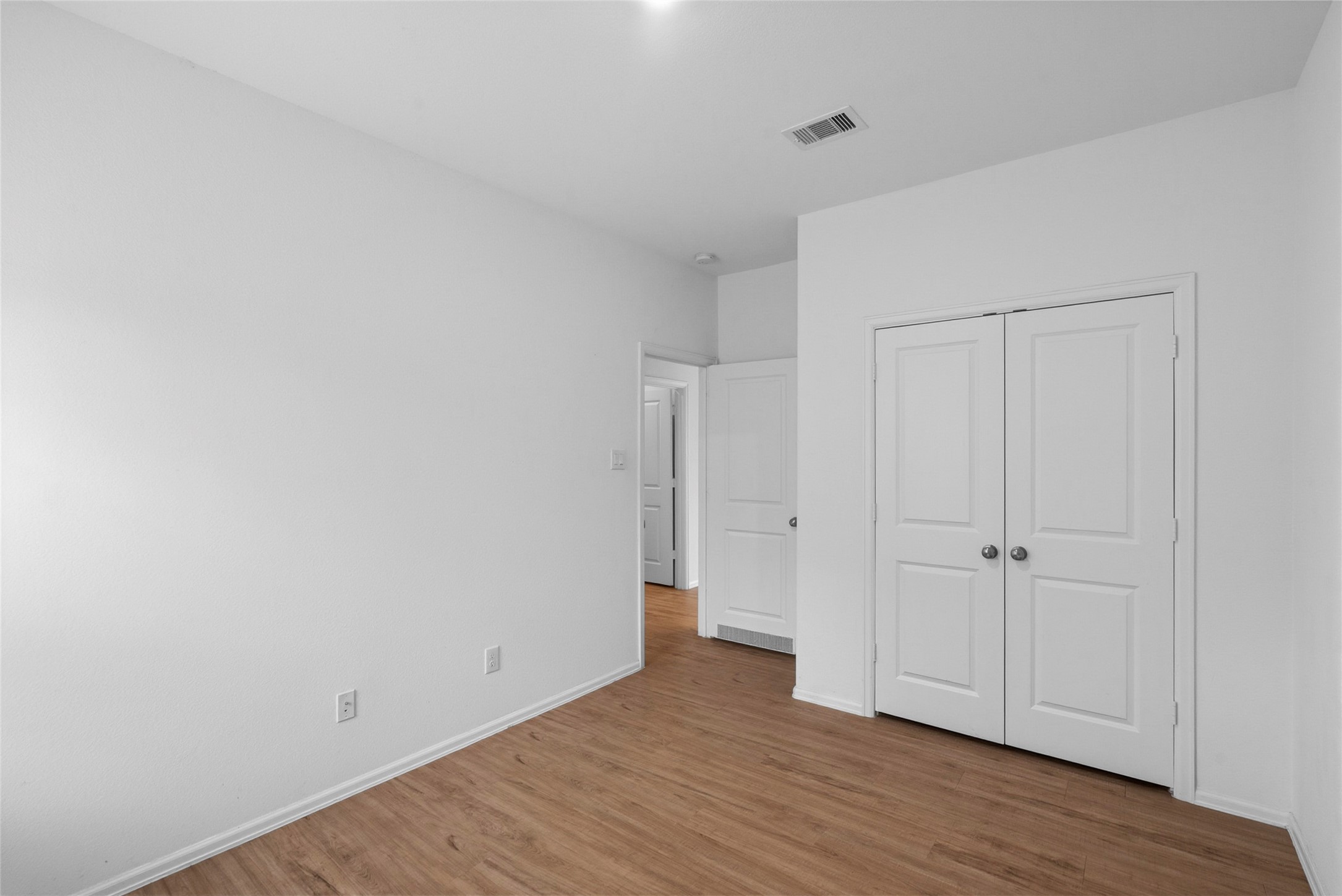 3705 Paloma Fls Lane Rosenberg, TX 77469 - Photo 18 of 27 Another angle of Clean-lined bedroom with wood-look floors and a bright, neutral palette