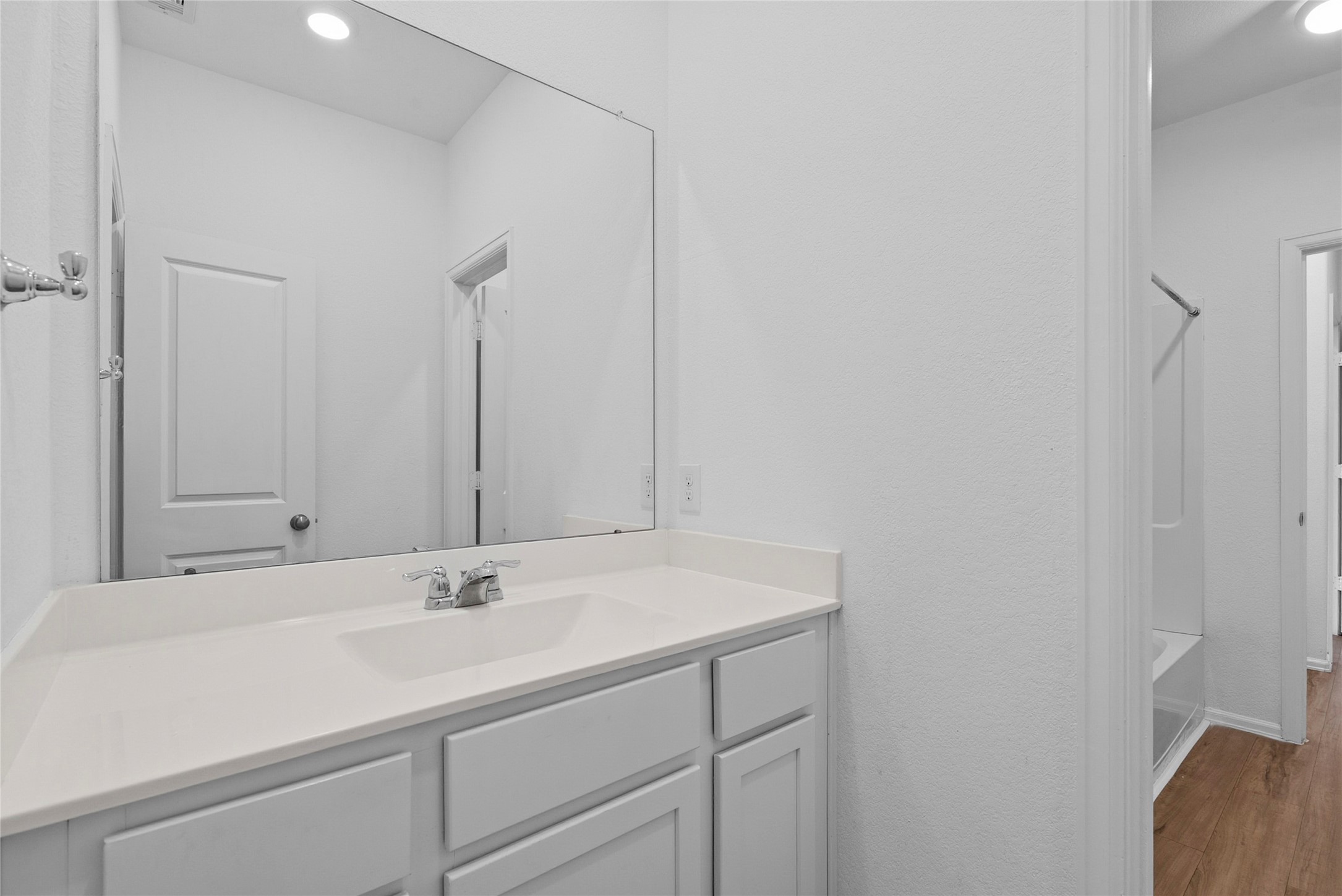 3705 Paloma Fls Lane Rosenberg, TX 77469 - Photo 19 of 27 Clean bathroom vanity with a wide countertop, single sink, and oversized mirror for a bright, open feel.