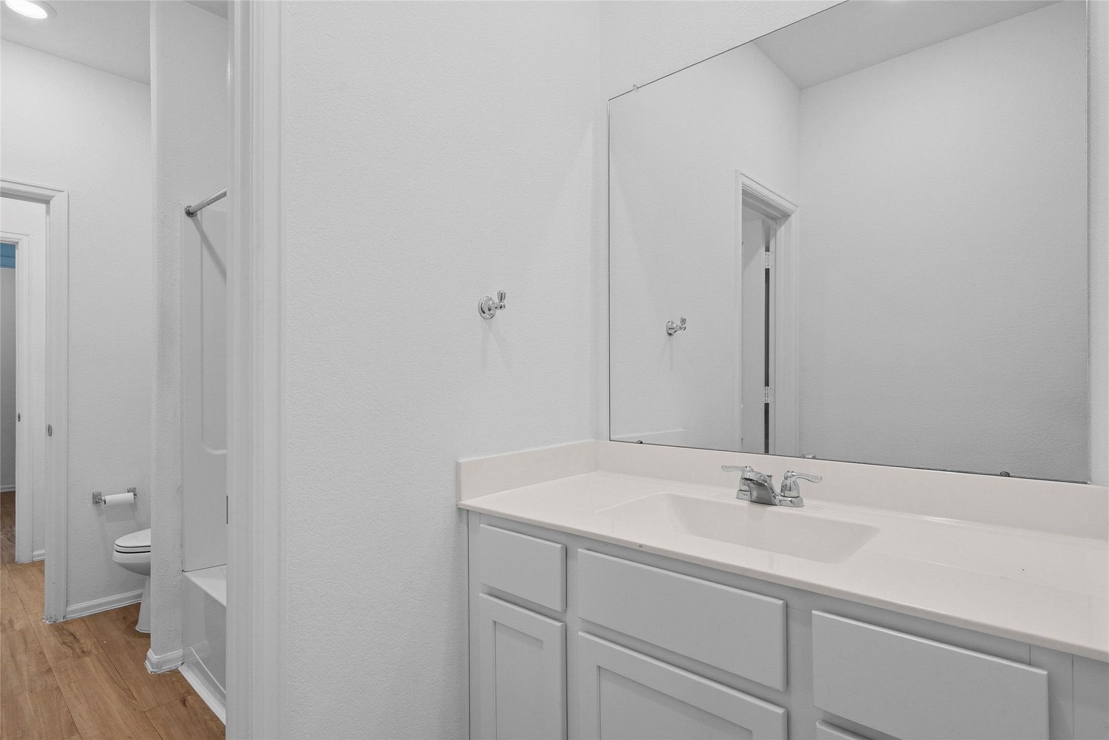 3705 Paloma Fls Lane Rosenberg, TX 77469 - Photo 20 of 27 Bright full bath with a long vanity, single-basin sink, and a wall-to-wall mirror.