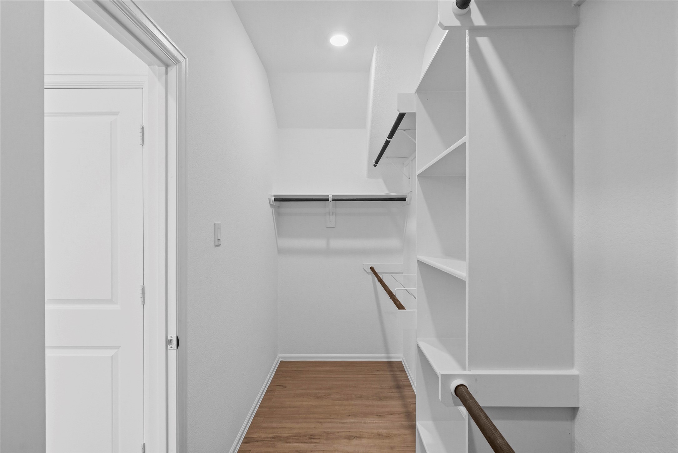 3705 Paloma Fls Lane Rosenberg, TX 77469 - Photo 24 of 27 Spacious walk-in closet with built-in shelving and multiple hanging rods for easy organization.