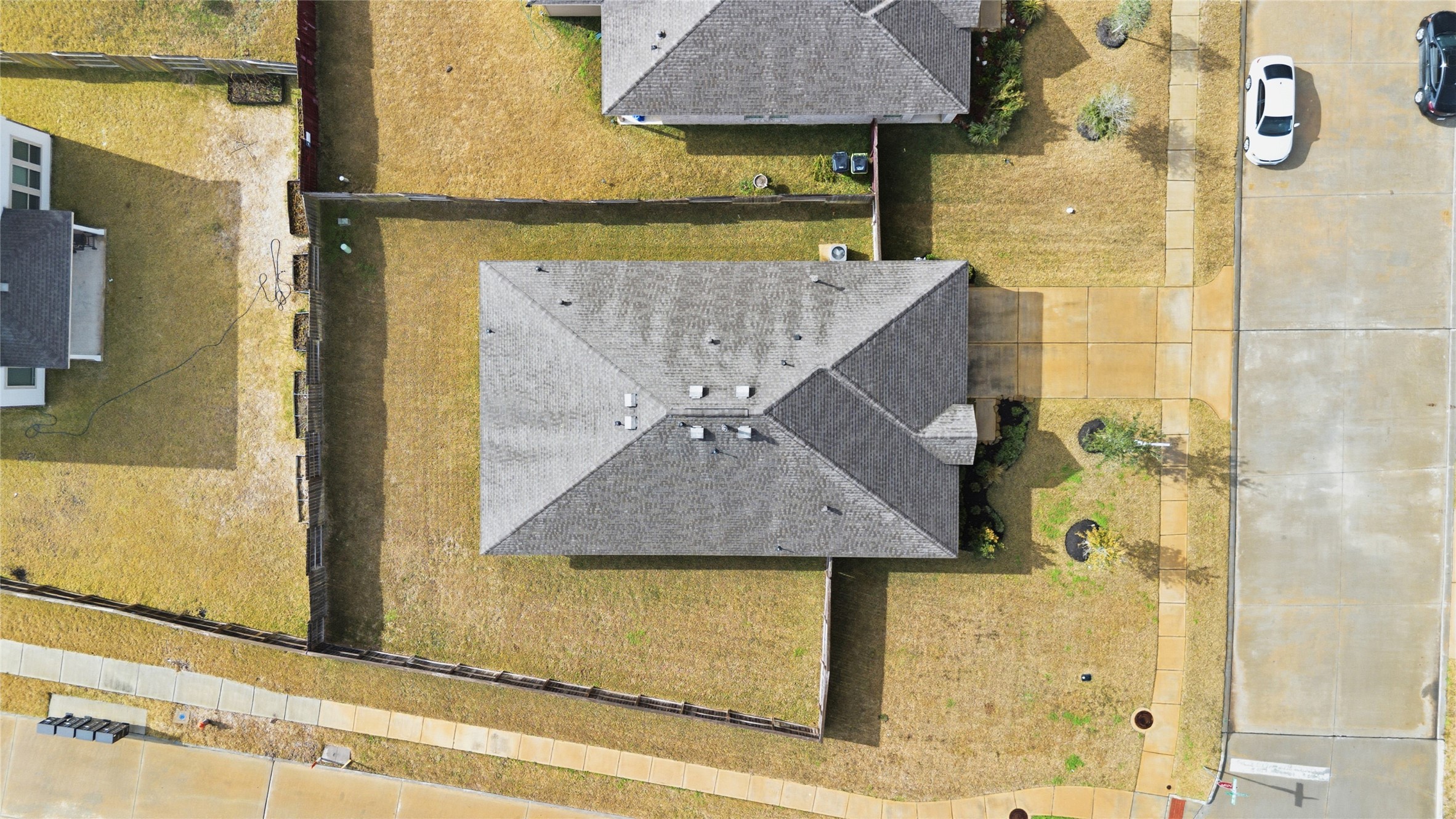 3705 Paloma Fls Lane Rosenberg, TX 77469 - Photo 3 of 27 Top-down aerial view outlines the home’s roofline and fully fenced yard within the surrounding lots