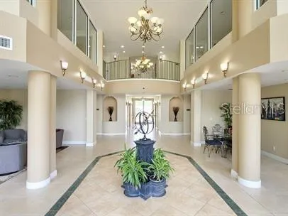 a view of a lobby with furniture and a chandelier