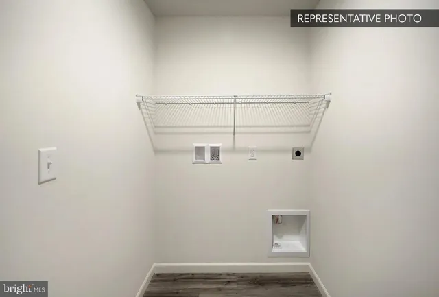 a bathroom with a sink a toilet a mirror and shower