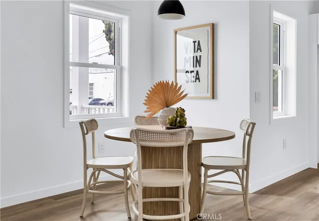 a kitchen with sink a refrigerator and cabinets