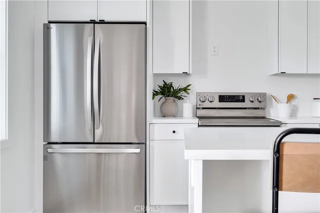 a kitchen with a sink cabinets and window