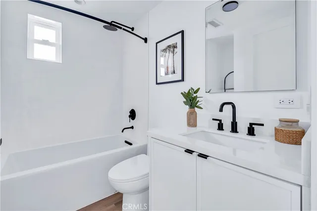 a bedroom with a bed and a view of bathroom