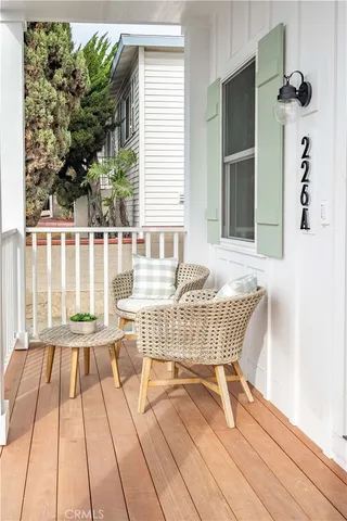 a view of a chairs and table on the deck
