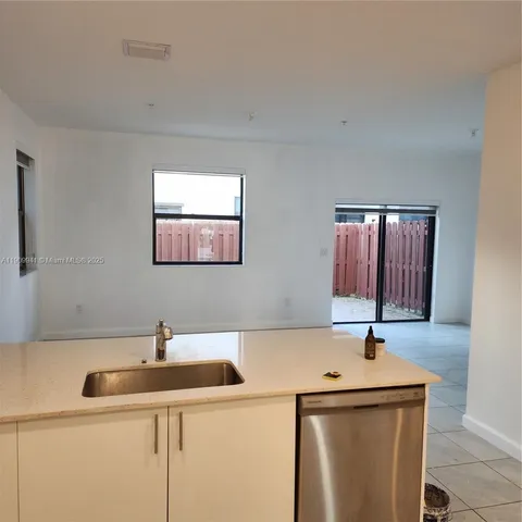 a bathroom with a sink and a window