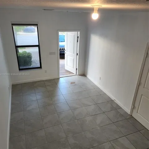 a view of an empty room and window