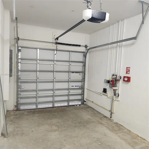 a view of an empty room with a staircase