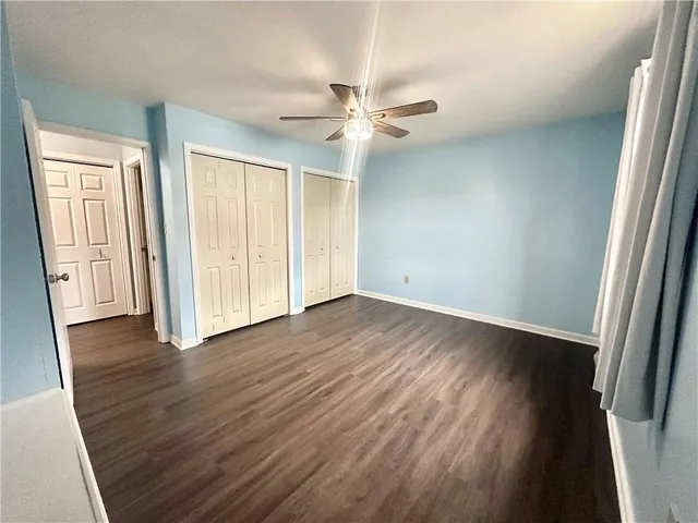 a bathroom with a sink a toilet and shower curtain