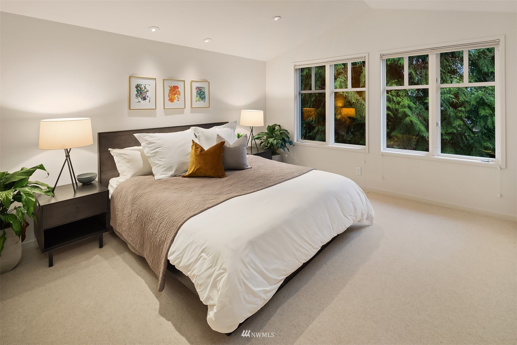 3022 Hunts Point Road Hunts Point, WA 98004 - Photo 23 of 37 a bedroom with a large bed and a large window