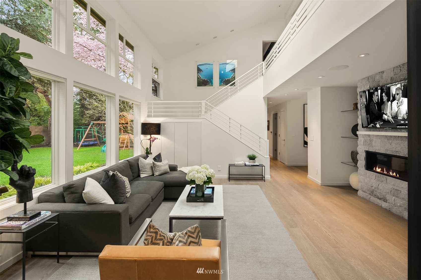 3022 Hunts Point Road Hunts Point, WA 98004 - Photo 9 of 37 a living room with furniture and a fireplace