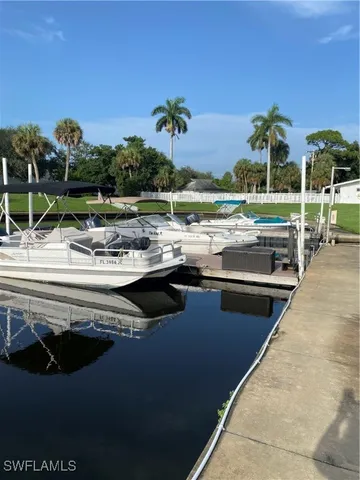 a view of a swimming pool with an outdoor seating