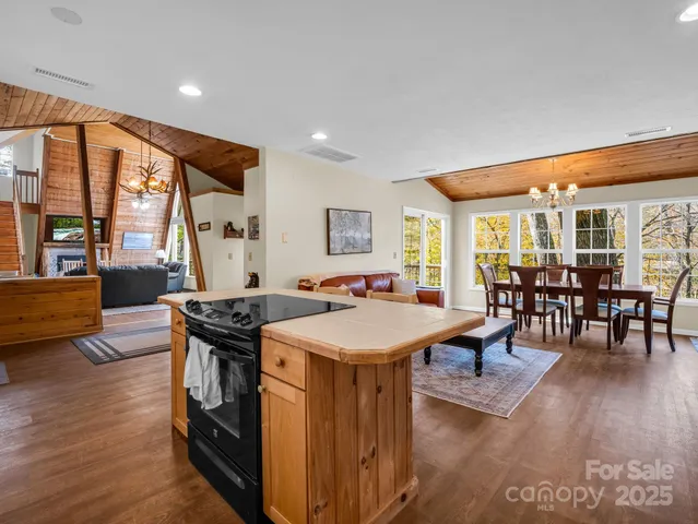 a view of a porch with wooden floor and outdoor seating