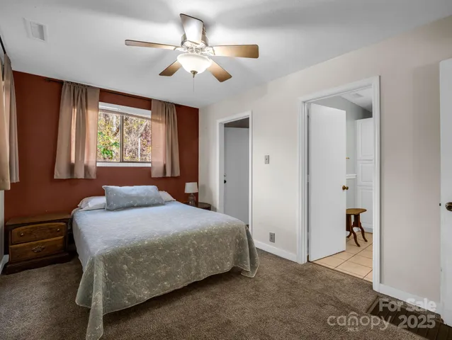 a view of a big room with closet and windows