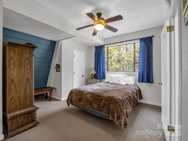 a backyard of a house with a yard and outdoor seating