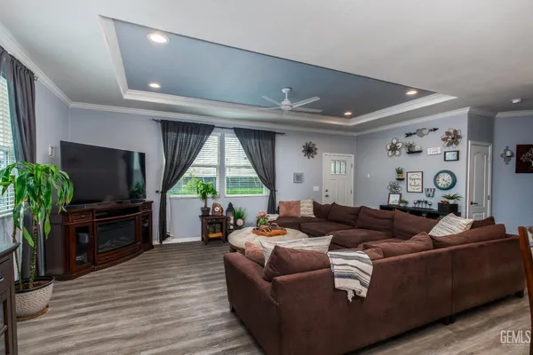 a large kitchen with stainless steel appliances lots of counter space sink refrigerator and cabinets