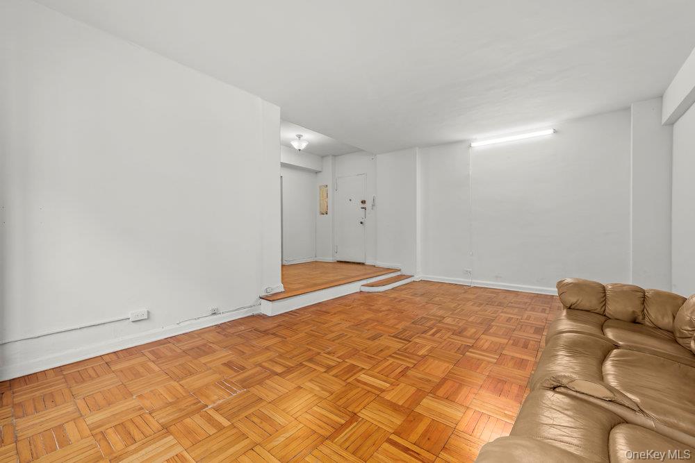 98-26 64th Avenue, Unit 3D Queens, NY 11374 - Photo 4 of 11 a view of a room with a wooden floor