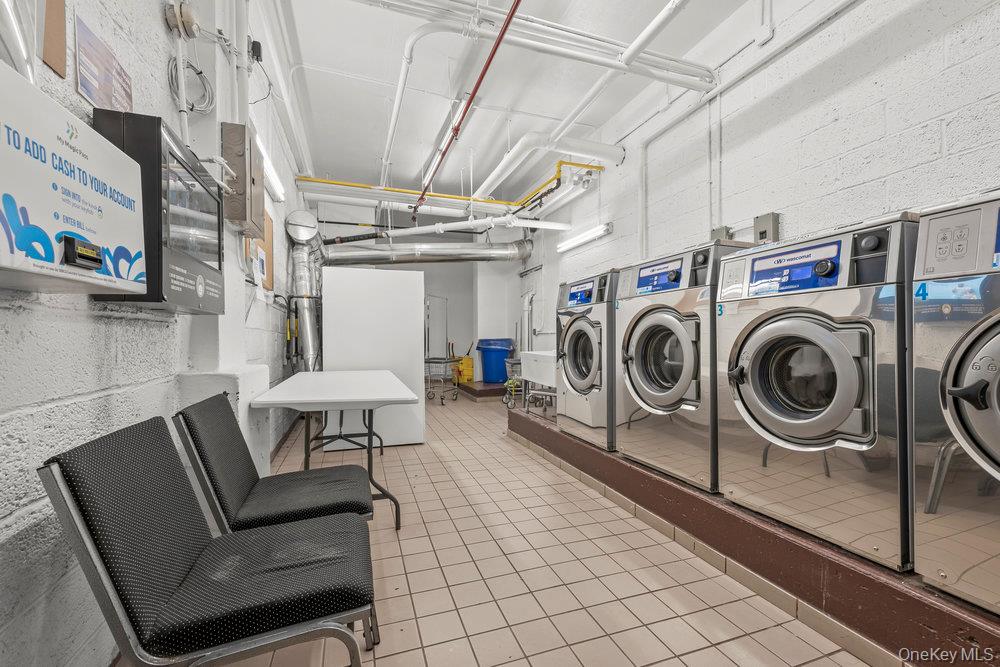 98-26 64th Avenue, Unit 3D Queens, NY 11374 - Photo 10 of 11 a utility room with dryer and washer