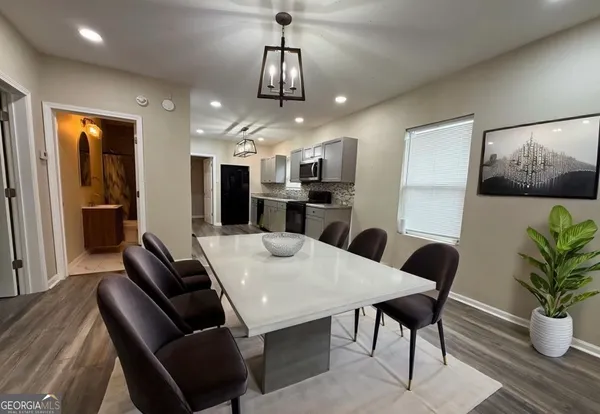 a view of a kitchen from the hallway