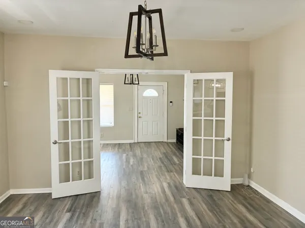 a bathroom with a sink mirror and toilet