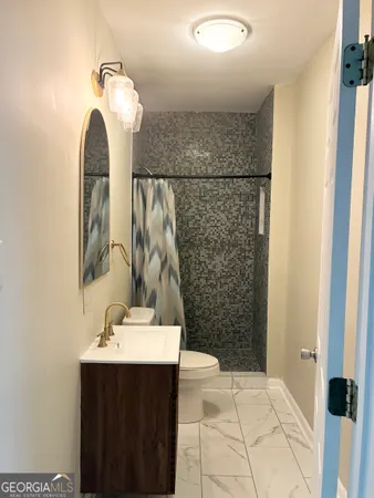a bathroom with a sink and mirror