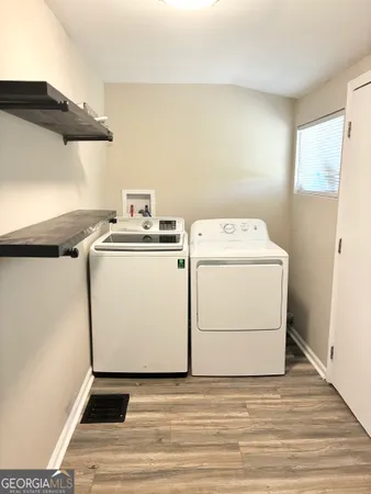 a view of a bench in backyard of house