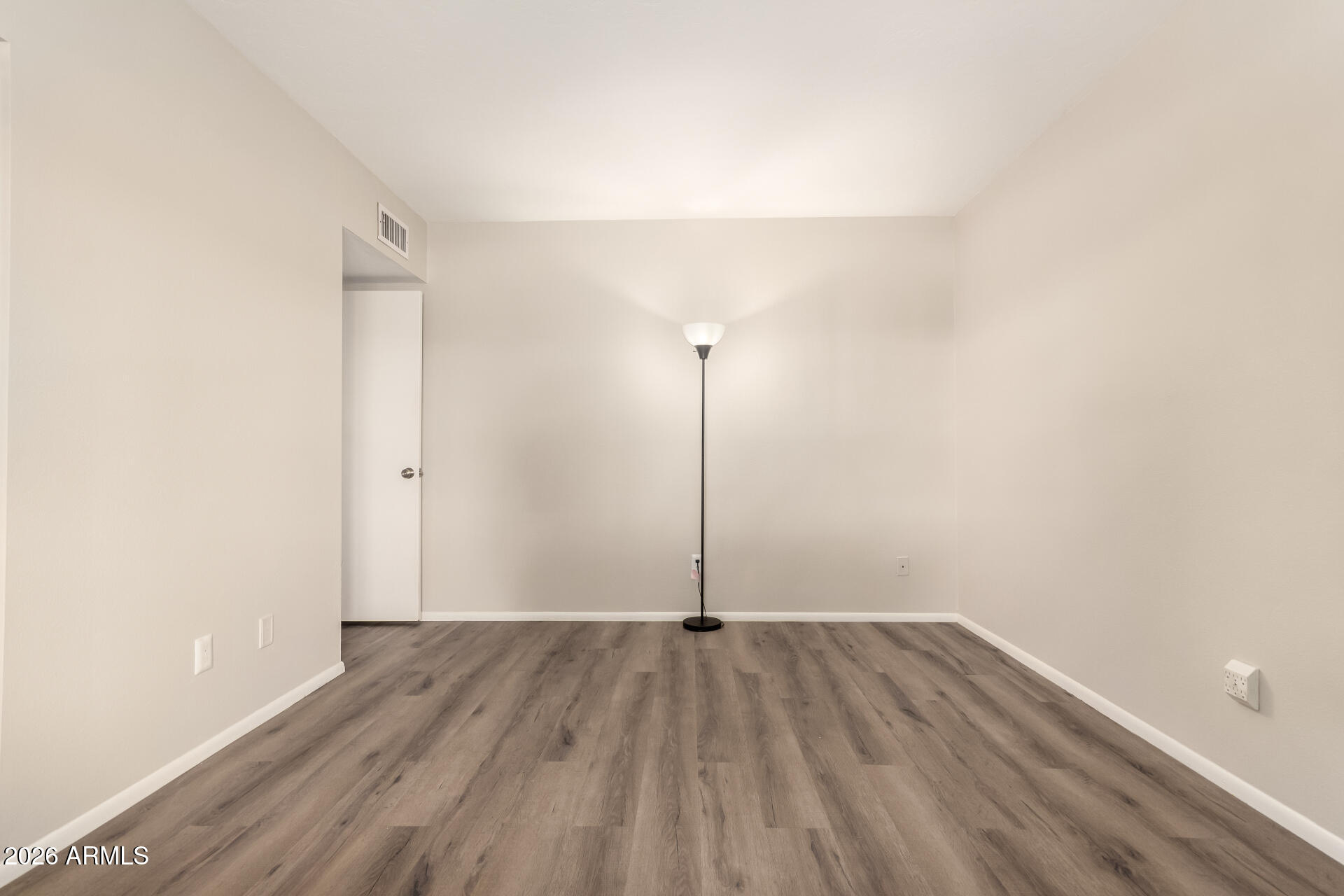1833 West Citrus Way Phoenix, AZ 85015 - Photo 10 of 36 a view of a room with wooden floor