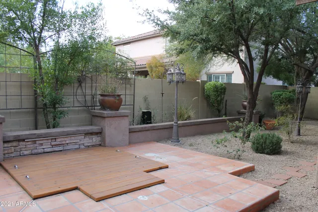 a view of a garden with patio
