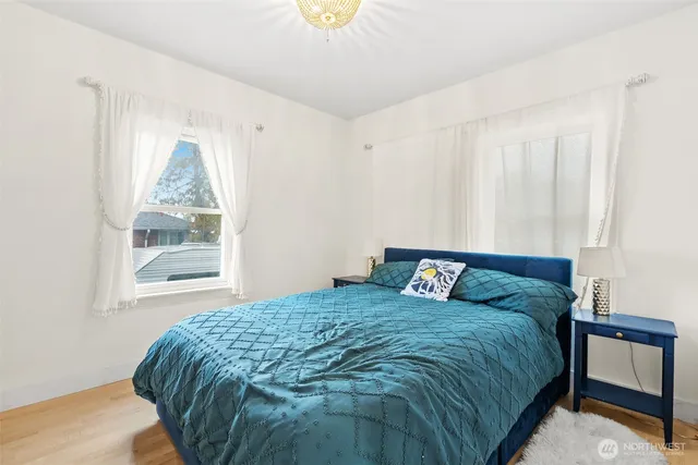 a bedroom with furniture and a window