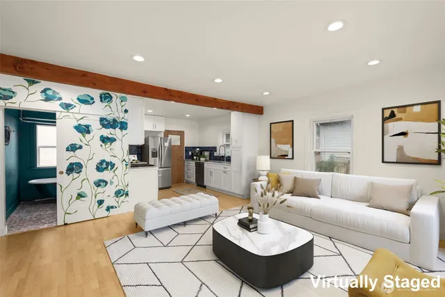 a living room with furniture and a rug