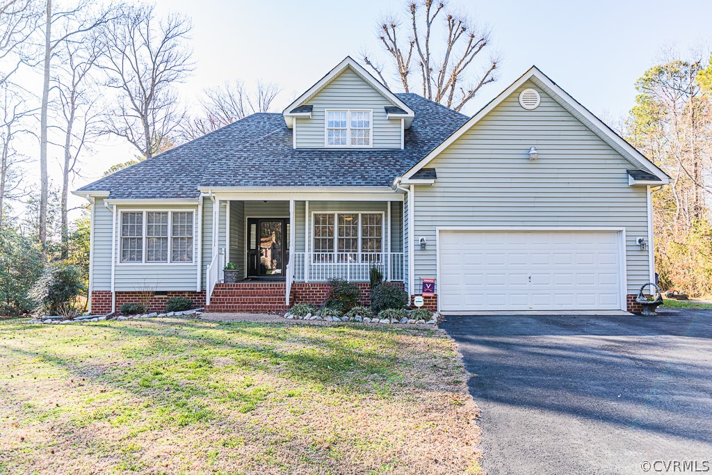 3620 Winterhaven Road Midlothian, VA 23112 - Photo 1 of 42 a front view of a house with a yard and garage