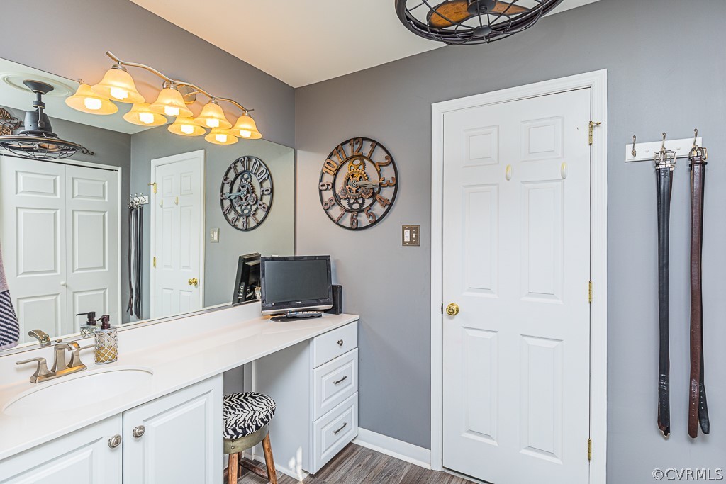 3620 Winterhaven Road Midlothian, VA 23112 - Photo 24 of 42 a bathroom with a sink a vanity and a mirror
