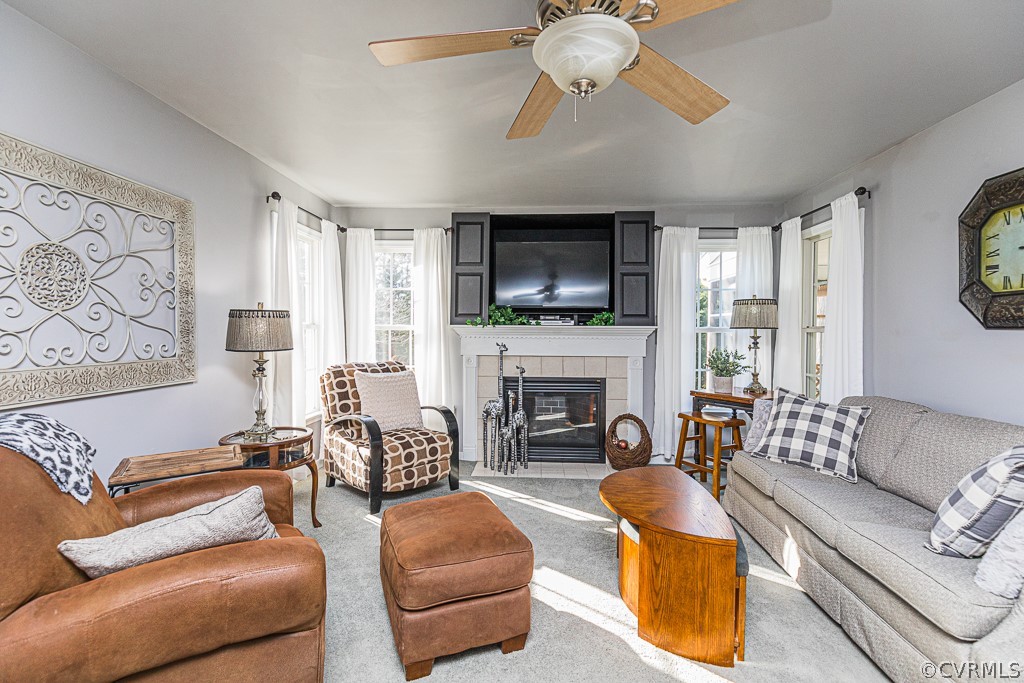 3620 Winterhaven Road Midlothian, VA 23112 - Photo 3 of 42 a living room with furniture a fireplace and a flat screen tv