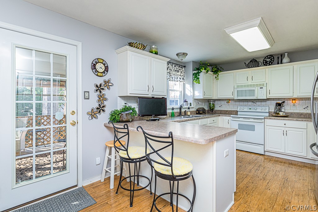 3620 Winterhaven Road Midlothian, VA 23112 - Photo 8 of 42 a kitchen with stainless steel appliances kitchen island granite countertop a table and chairs in it