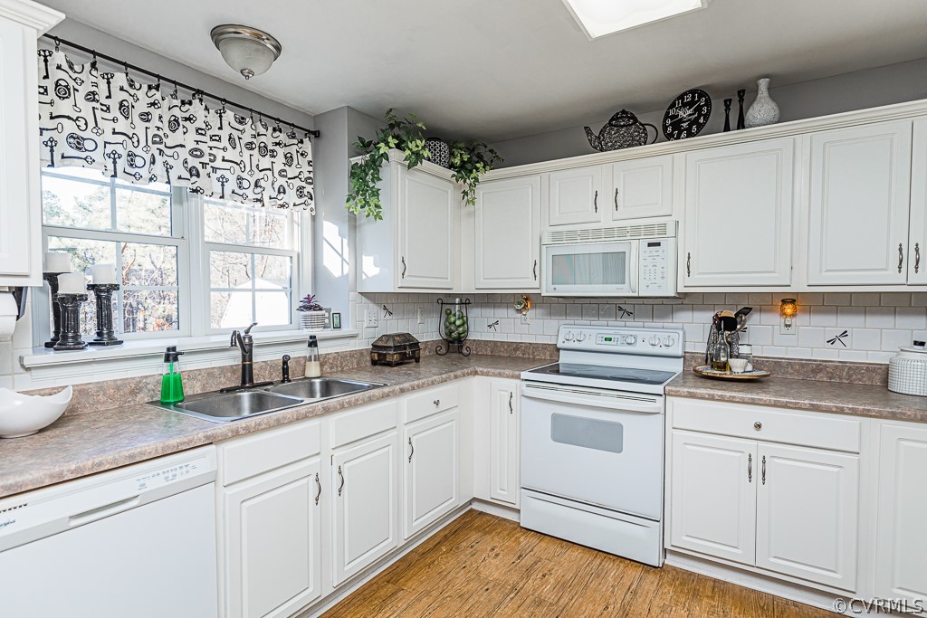 3620 Winterhaven Road Midlothian, VA 23112 - Photo 10 of 42 a kitchen with granite countertop white cabinets white appliances a sink and a window