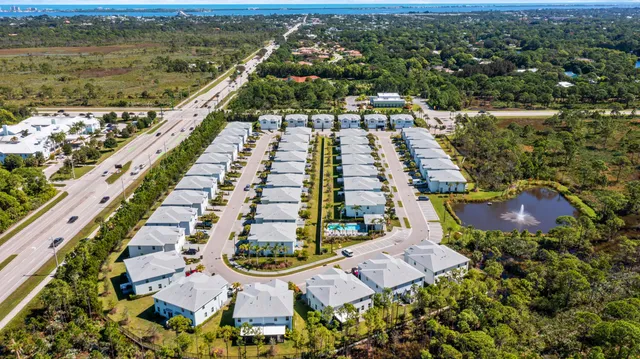 an aerial view of residential houses with outdoor space
