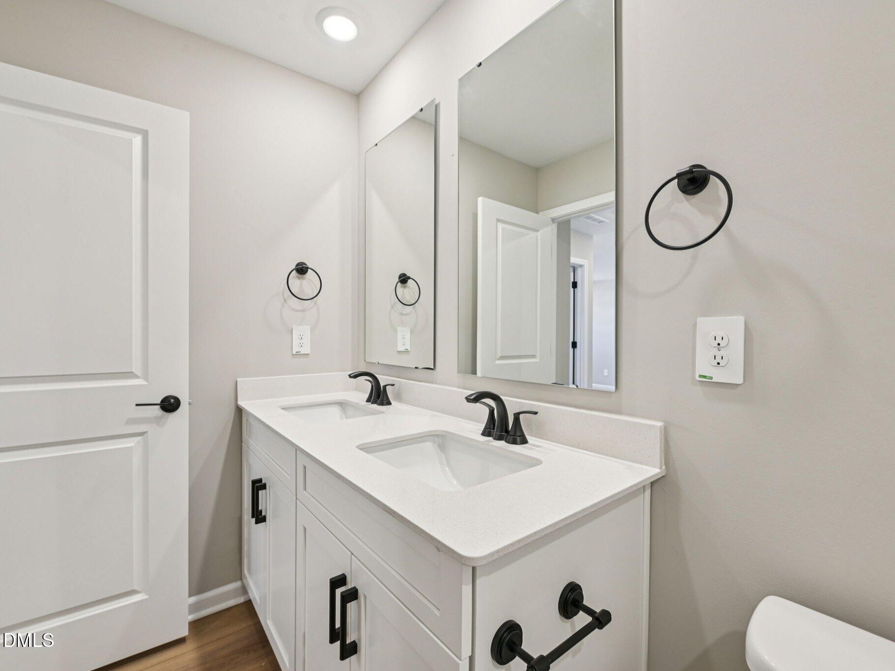 3516 Telluride Trail Raleigh, NC 27616 - Photo 39 of 47 a bathroom with a sink and a mirror