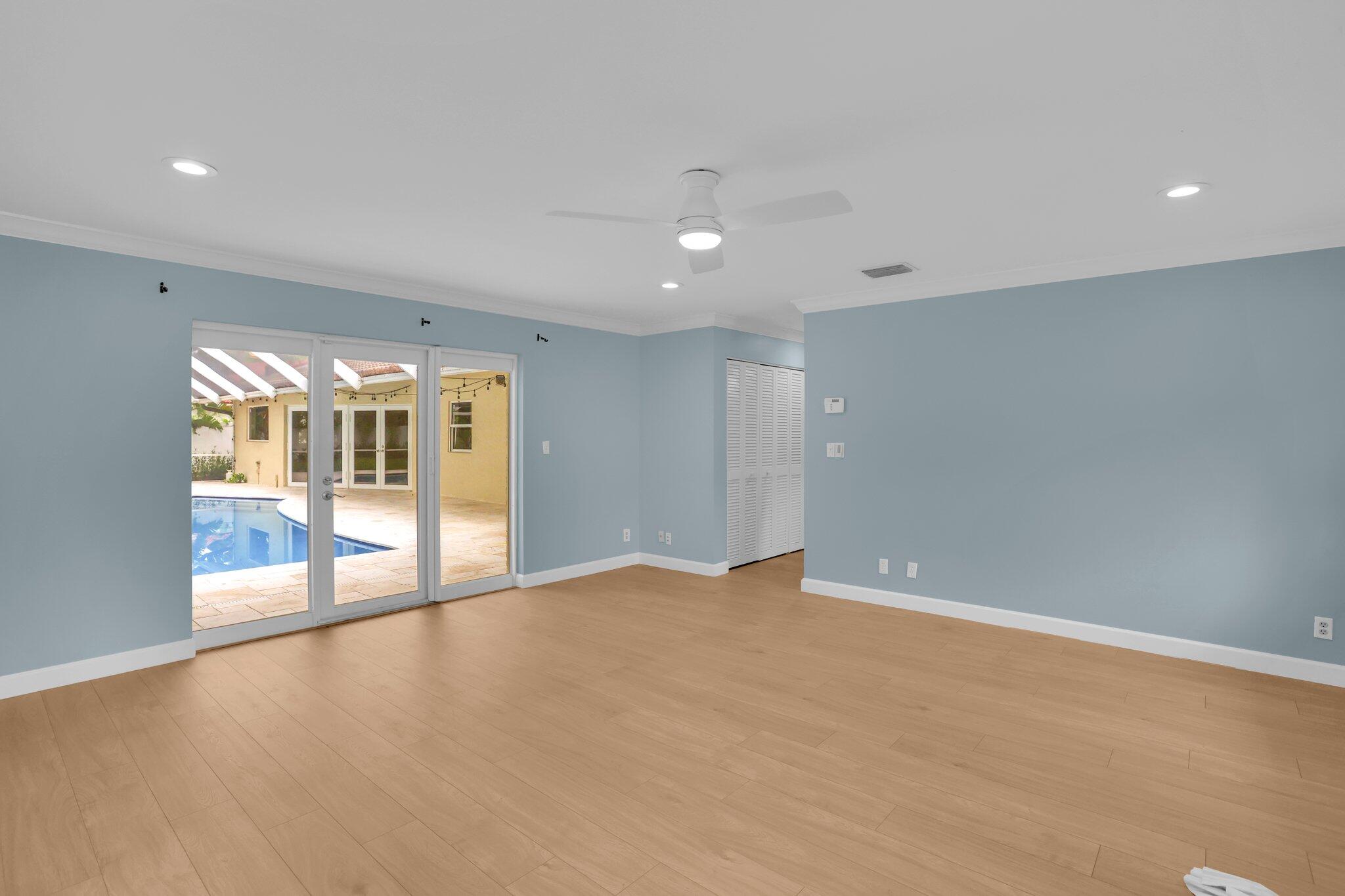 6769 Entrada Place Boca Raton, FL 33433 - Photo 15 of 47 an empty room with floor to ceiling window and an outdoor view