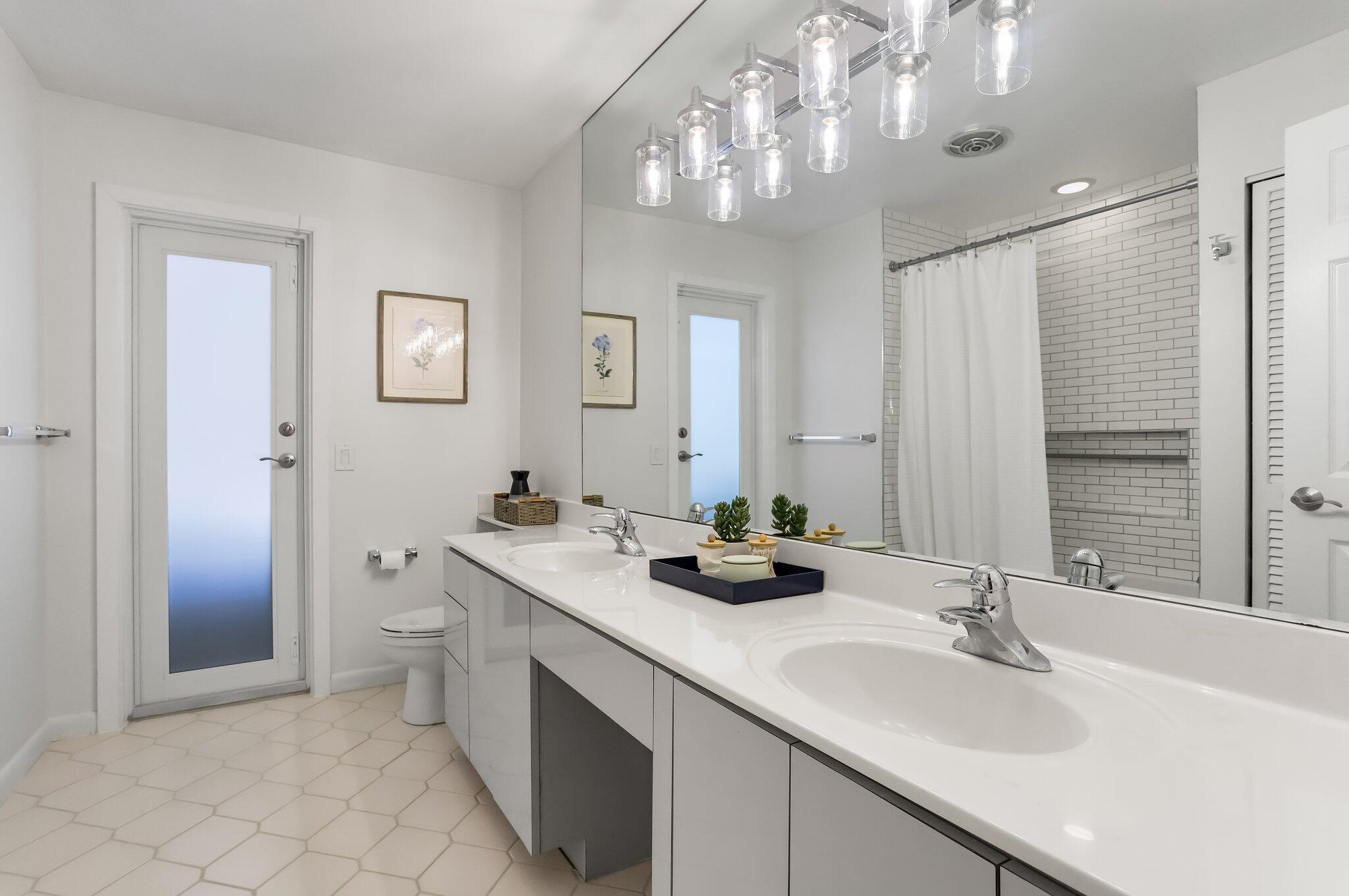 6769 Entrada Place Boca Raton, FL 33433 - Photo 28 of 47 a bathroom with a sink double vanity and a mirror