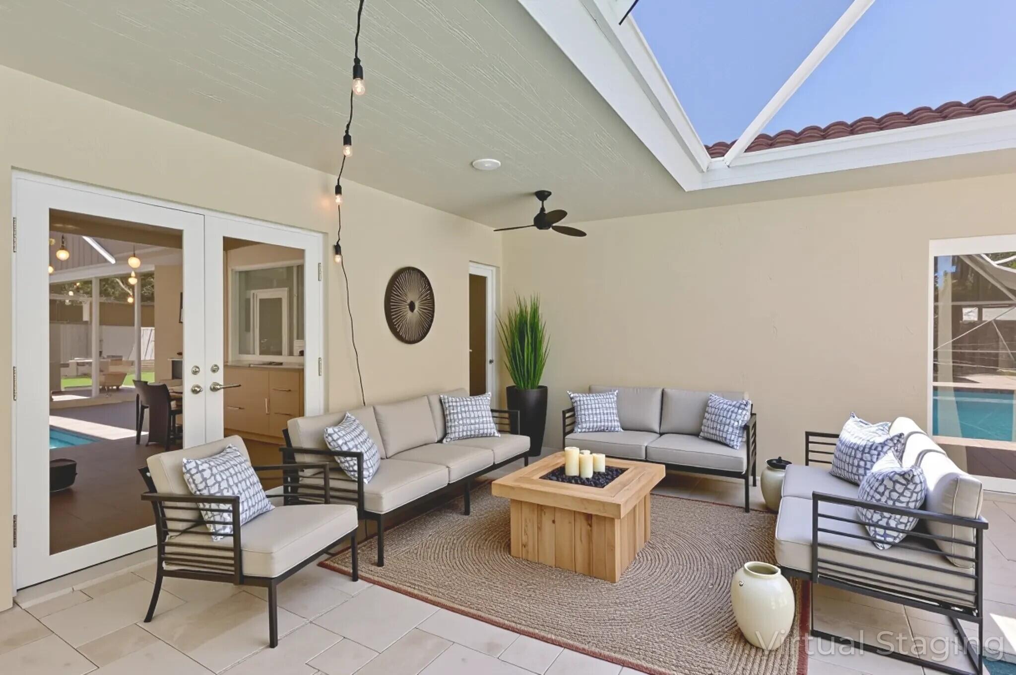 6769 Entrada Place Boca Raton, FL 33433 - Photo 36 of 47 a living room with furniture and a clock