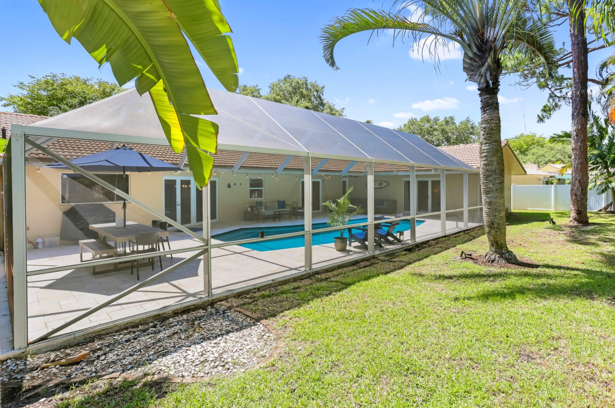 6769 Entrada Place Boca Raton, FL 33433 - Photo 37 of 47 a view of a house with backyard and sitting area