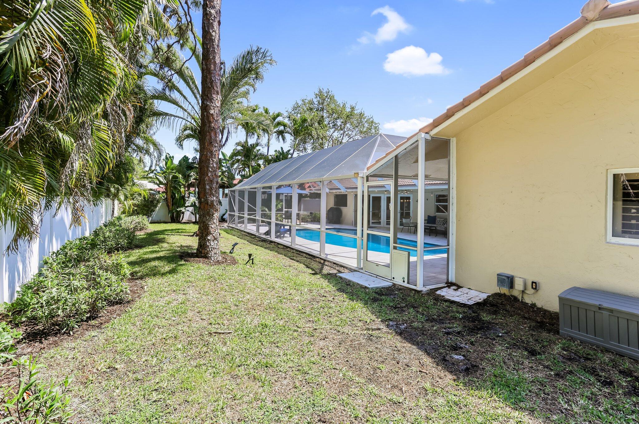 6769 Entrada Place Boca Raton, FL 33433 - Photo 38 of 47 a view of house with backyard and swimming pool