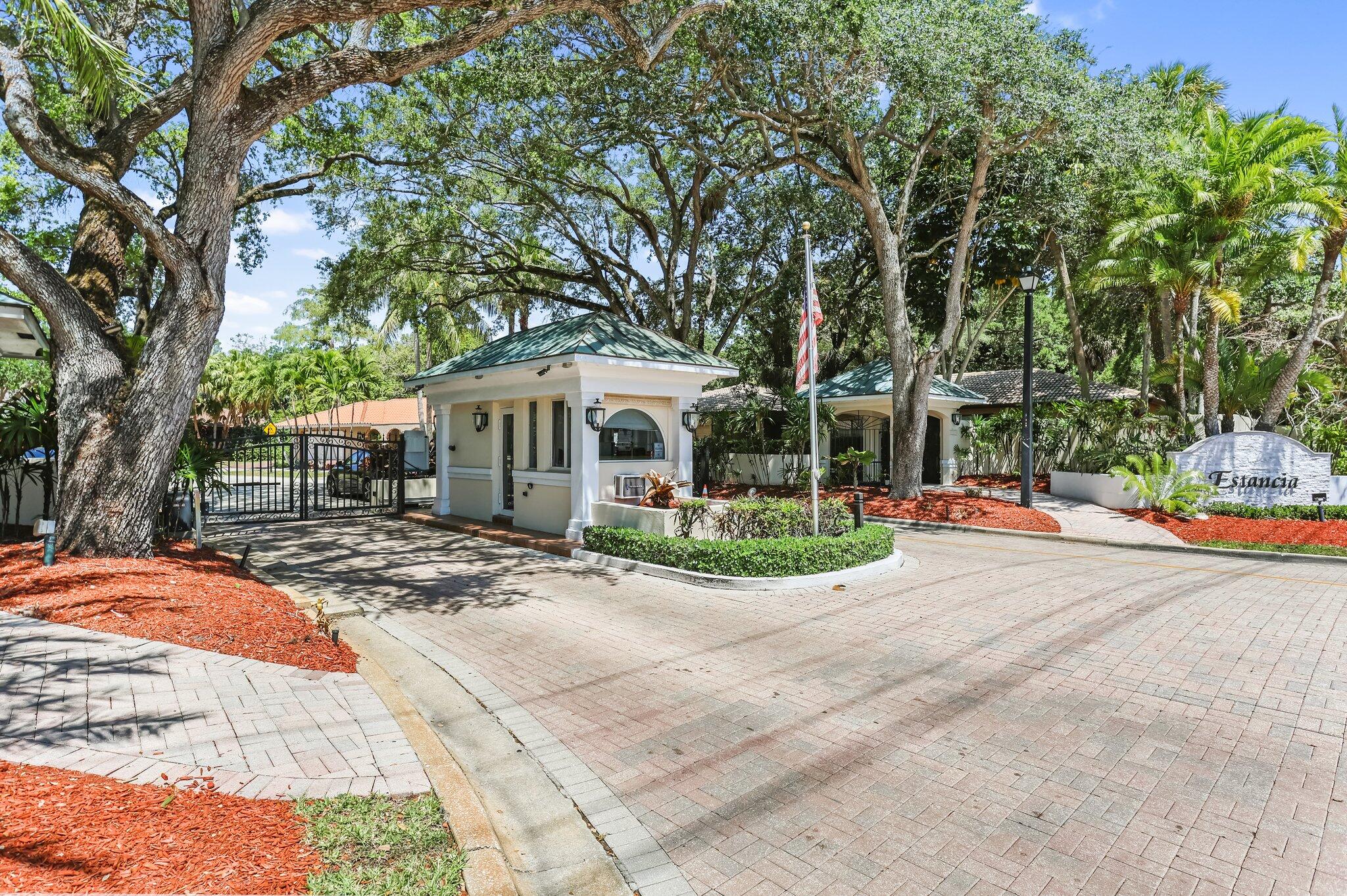 6769 Entrada Place Boca Raton, FL 33433 - Photo 41 of 47 a view of a white house with a big yard and large tree