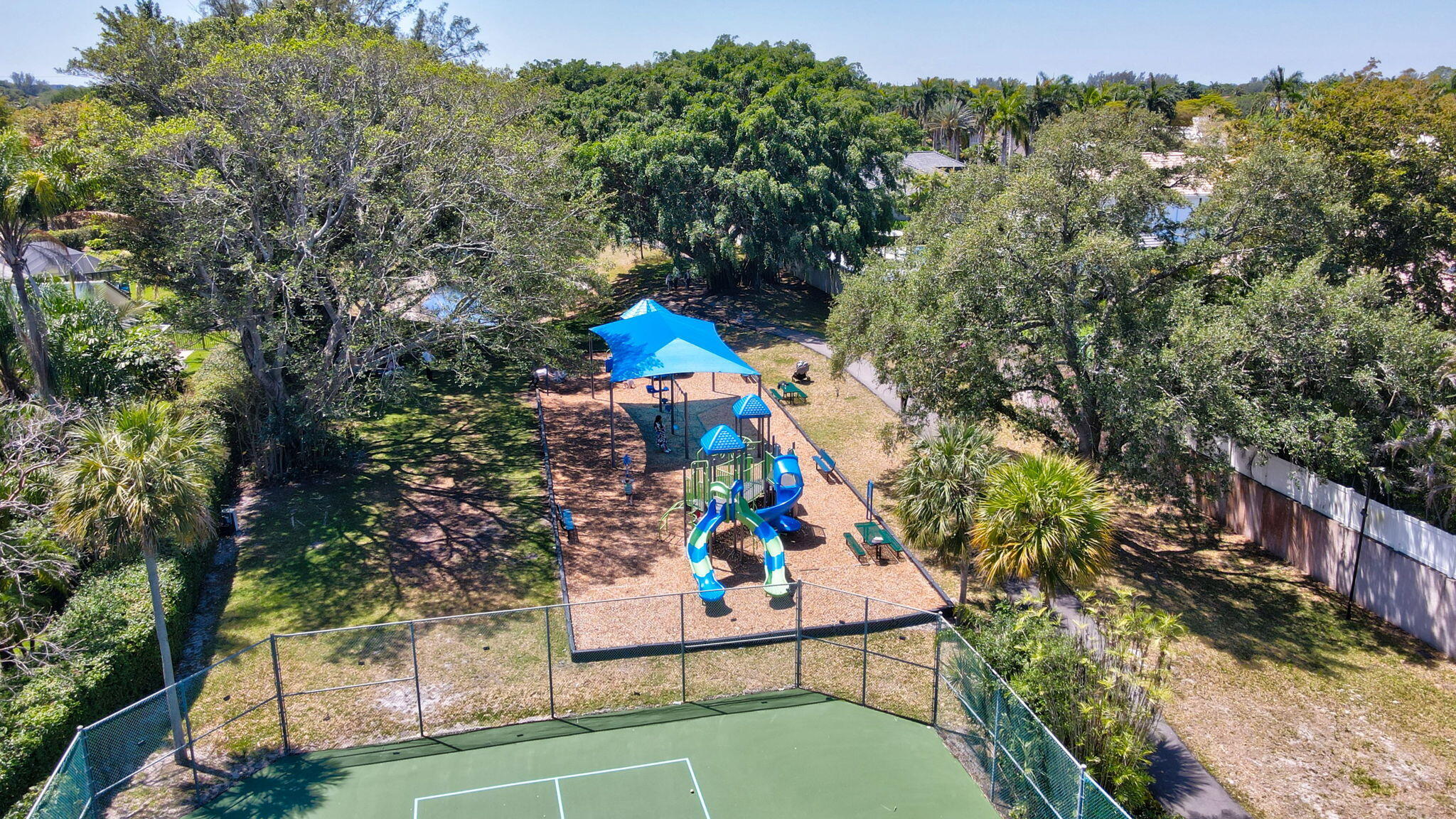 6769 Entrada Place Boca Raton, FL 33433 - Photo 46 of 47 an outdoor space with seating area and trees around