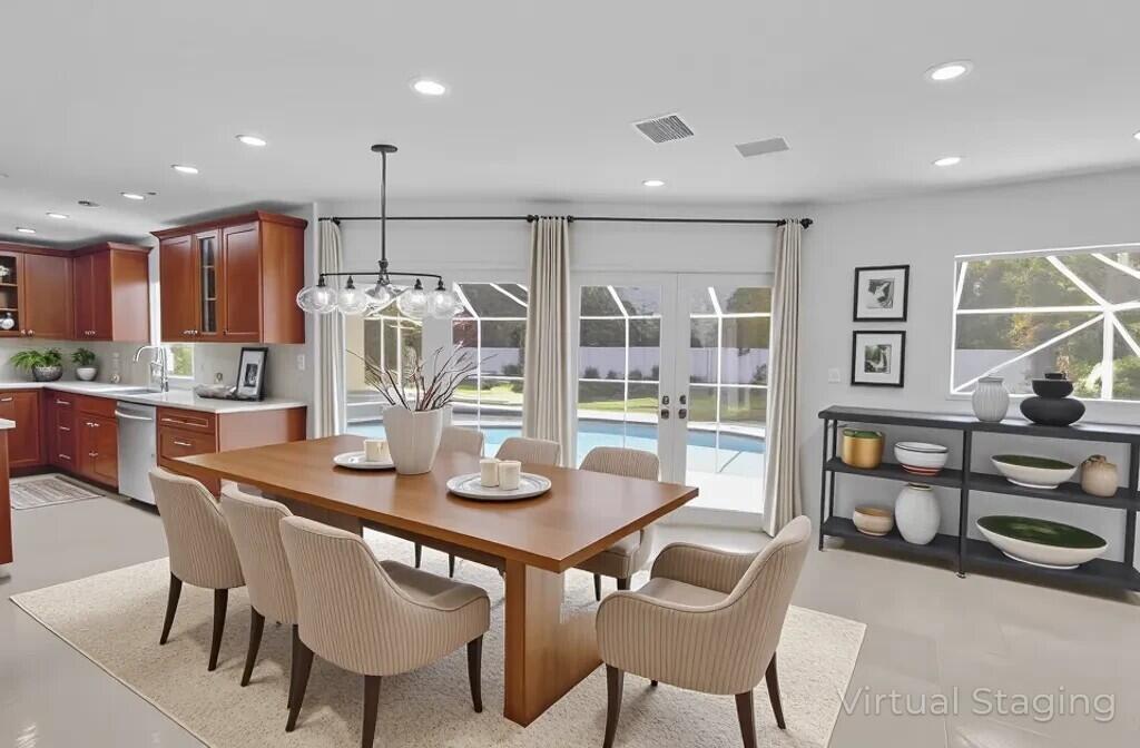 6769 Entrada Place Boca Raton, FL 33433 - Photo 9 of 47 a view of a dining room with furniture and chandelier