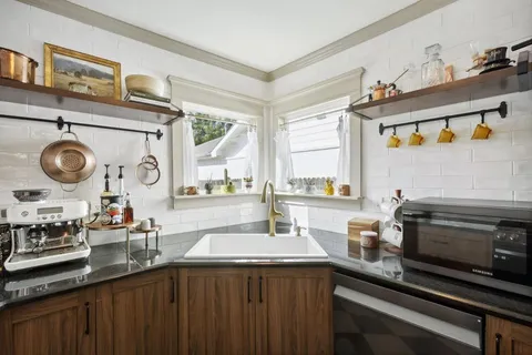 a kitchen with lots of counter top space and stove