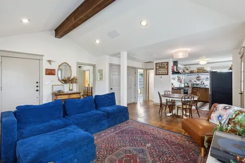 a bedroom with a bed cabinets and book shelf